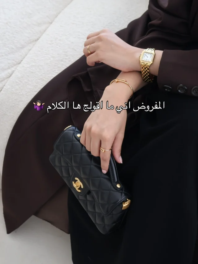 Styled look with gold watch and black bag
